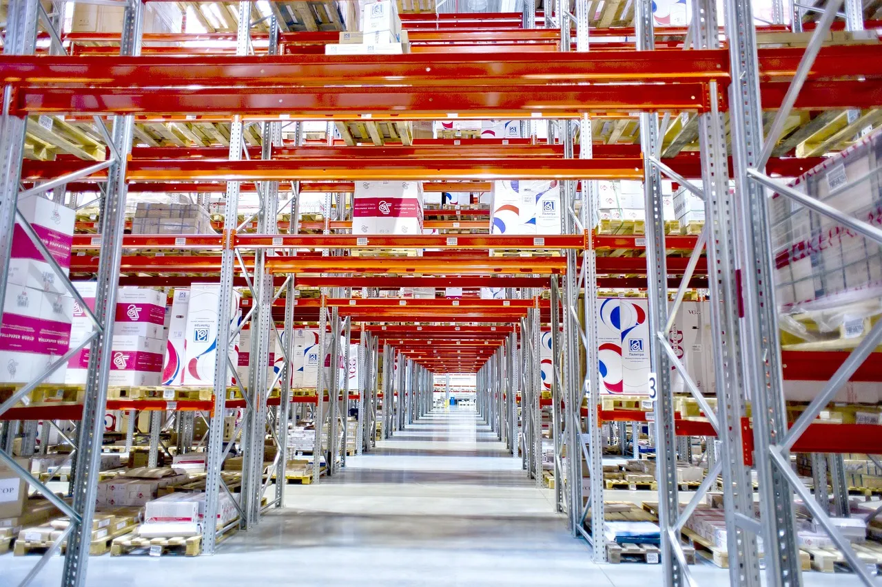 The interior of a modern logistics center warehouse.